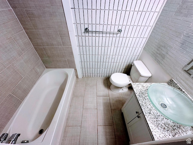 1866 W Homestead Farms Ln S Unit 1, Salt Lake City, UT 84119 - full bath featuring toilet, a tub to relax in, tile walls, and vanity