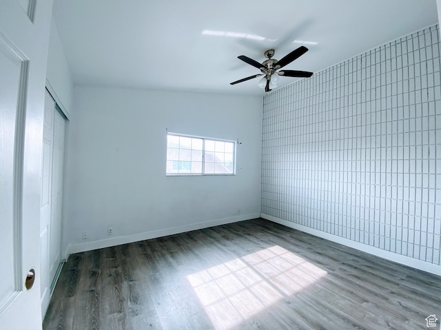 1866 W Homestead Farms Ln S Unit 1, Salt Lake City, UT 84119 - empty room featuring dark wood-style floors, baseboards, and a ceiling fan