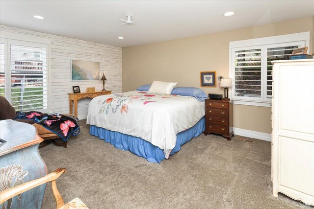 bedroom with recessed lighting, baseboards, and carpet floors