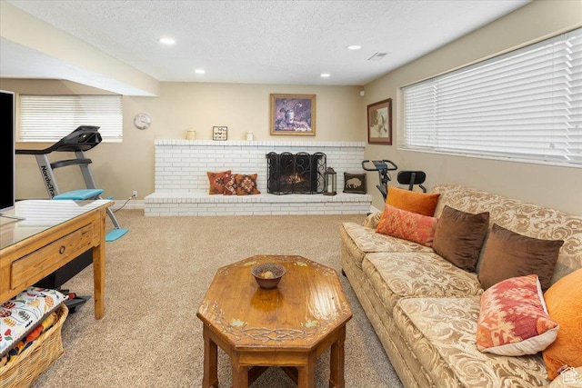 living area featuring recessed lighting, carpet flooring, and plenty of natural light