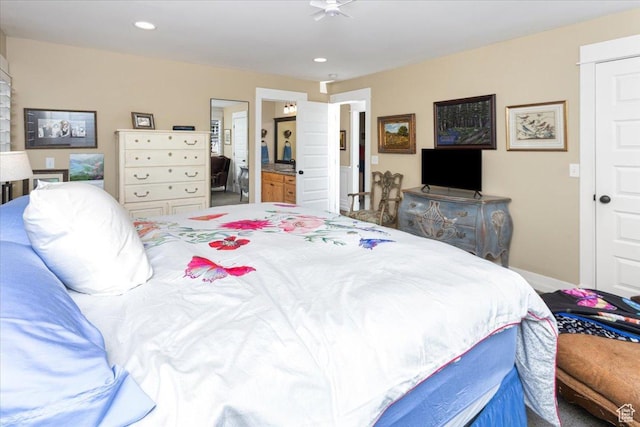 bedroom featuring recessed lighting, ensuite bath, and baseboards