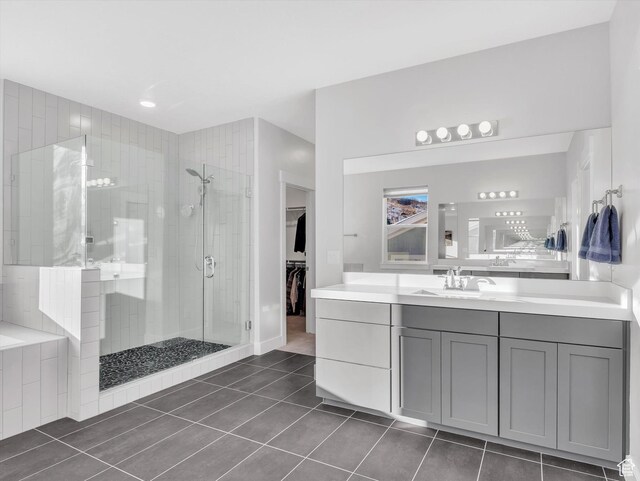 14678 S Silver Blossom Way E, Draper, UT 84020 - full bathroom with a shower stall, tile patterned flooring, vanity, and a walk in closet