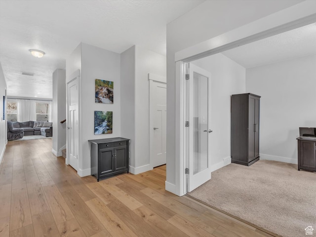 14678 S Silver Blossom Way E, Draper, UT 84020 - hallway with baseboards and light wood-type flooring