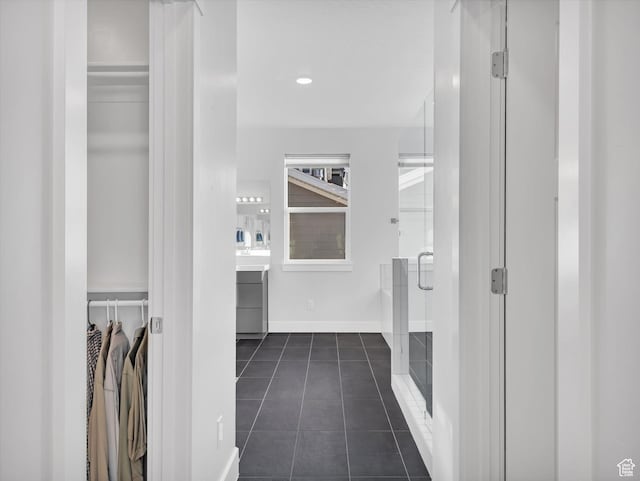 14678 S Silver Blossom Way E, Draper, UT 84020 - bathroom with tile patterned flooring, a walk in closet, a stall shower, and vanity