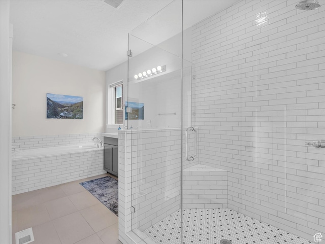 14678 S Silver Blossom Way E, Draper, UT 84020 - bathroom featuring a shower stall, vanity, tile patterned flooring, and a bath