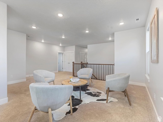 14678 S Silver Blossom Way E, Draper, UT 84020 - sitting room with light carpet, recessed lighting, and an upstairs landing