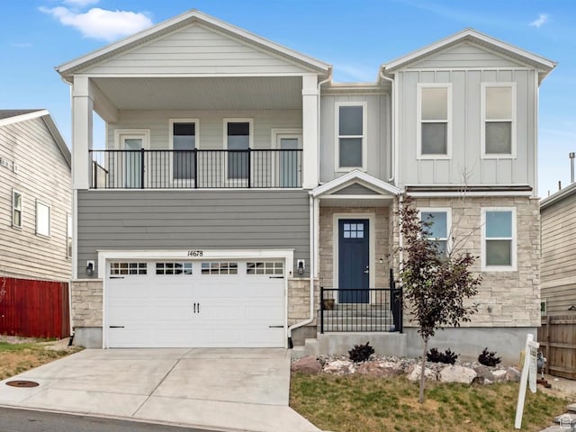 14678 S Silver Blossom Way E, Draper, UT 84020 - view of front of house featuring a balcony, stone siding, board and batten siding, driveway, and an attached garage