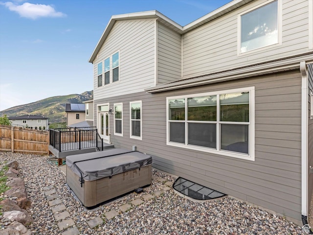 14678 S Silver Blossom Way E, Draper, UT 84020 - rear view of house featuring a hot tub and a deck with mountain view