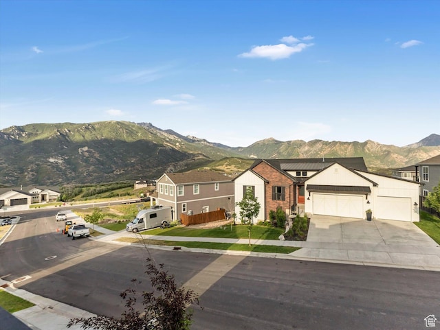 14678 S Silver Blossom Way E, Draper, UT 84020 - view of front of home featuring a mountain view, driveway, and an attached garage