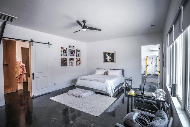 2906 N Purple Sage Rd, Apple Valley, UT 84737 - bedroom featuring a barn door, finished concrete floors, baseboards, a ceiling fan, and an AC wall unit