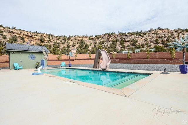 2906 N Purple Sage Rd, Apple Valley, UT 84737 - view of swimming pool with a water slide, a fenced backyard, and a patio area