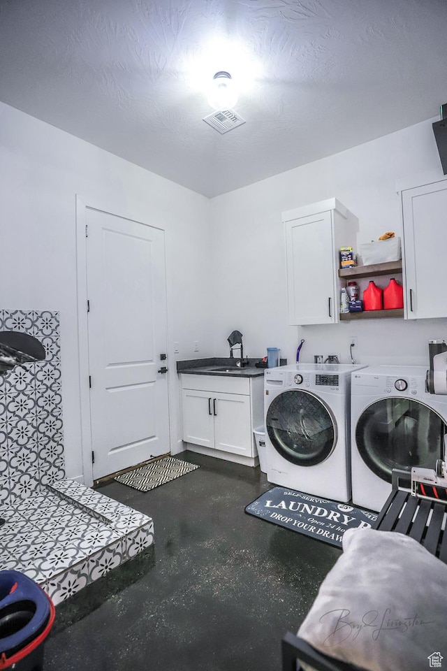 2906 N Purple Sage Rd, Apple Valley, UT 84737 - clothes washing area with cabinet space and washer and clothes dryer