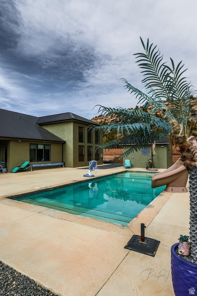 2906 N Purple Sage Rd, Apple Valley, UT 84737 - outdoor pool with a water slide and a patio area