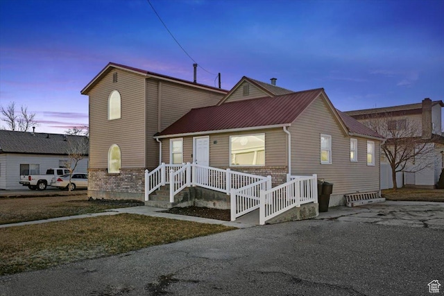 view of front of property featuring brick siding