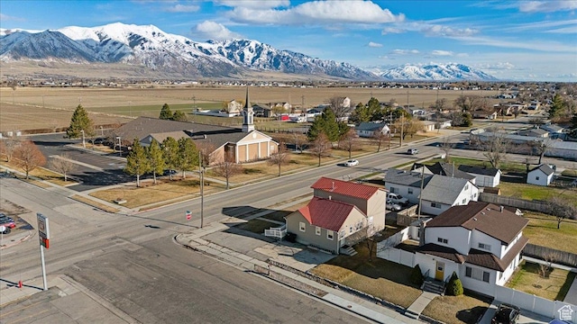 birds eye view of property with a residential view and a mountain view