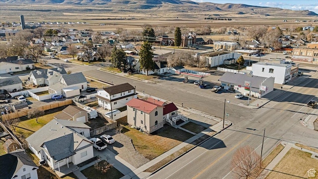 birds eye view of property featuring a mountain view and a residential view