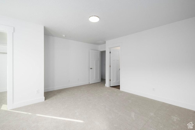1753 W 160 S Unit 45, Pleasant Grove, UT 84062 - unfurnished bedroom with a walk in closet, baseboards, a closet, and carpet flooring