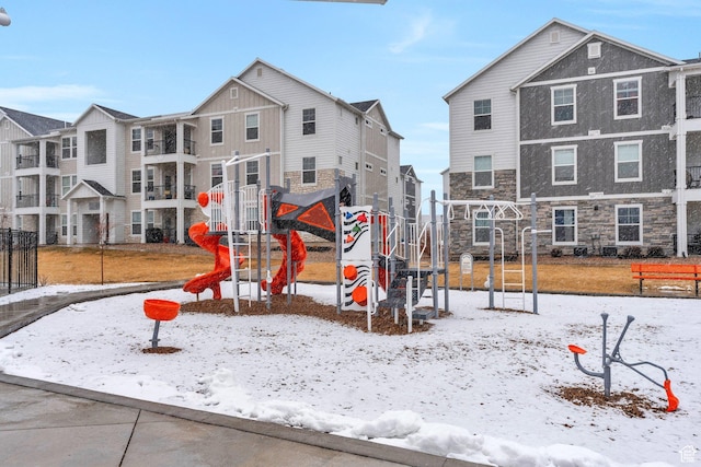 972 W Spider Green Way W Unit E201, Saratoga Springs, UT 84045 - snow covered playground featuring a playground and a residential view