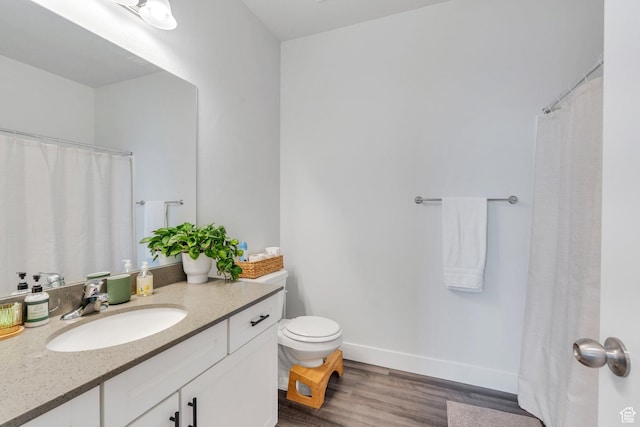 972 W Spider Green Way W Unit E201, Saratoga Springs, UT 84045 - bathroom featuring toilet, baseboards, wood finished floors, and vanity