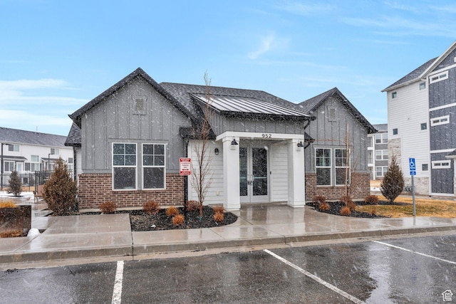 972 W Spider Green Way W Unit E201, Saratoga Springs, UT 84045 - view of front of property featuring french doors, brick siding, and board and batten siding