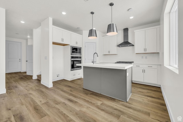 7181 Woods Rose Dr, Park City, UT 84098 - kitchen featuring stainless steel appliances, wall chimney exhaust hood, a sink, light countertops, and white cabinetry
