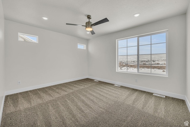 7181 Woods Rose Dr, Park City, UT 84098 - spare room featuring baseboards, healthy amount of natural light, carpet, ceiling fan, and recessed lighting