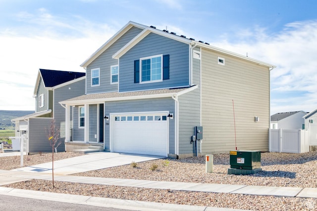 7181 Woods Rose Dr, Park City, UT 84098 - view of front facade with a garage, concrete driveway, and fence