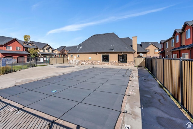 289 S 1000 W Unit 204, Pleasant Grove, UT 84062 - view of swimming pool with a patio area, a residential view, and fence