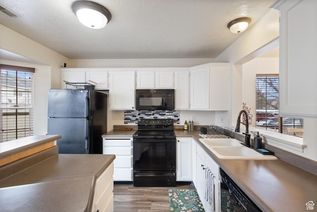 984 N Independence Ave W, Provo, UT 84604 - kitchen featuring decorative backsplash, white cabinetry, a sink, and black appliances