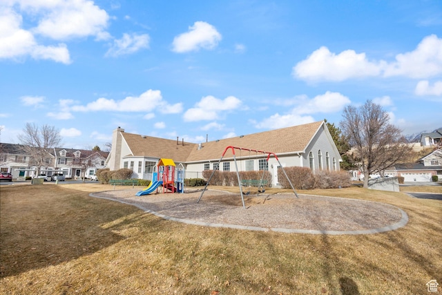 984 N Independence Ave W, Provo, UT 84604 - view of front of property with a residential view, playground community, a chimney, and a front lawn