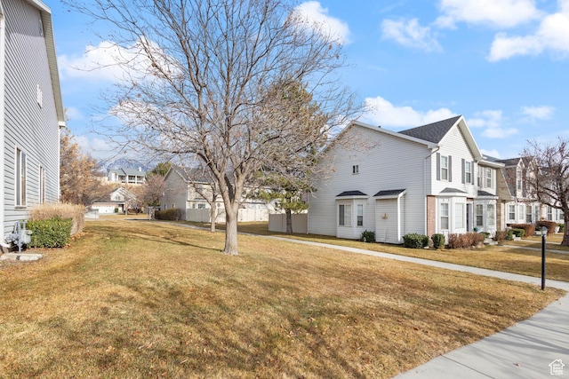984 N Independence Ave W, Provo, UT 84604 - view of property exterior featuring a yard and a residential view
