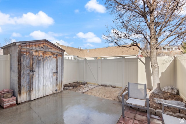 984 N Independence Ave W, Provo, UT 84604 - view of patio featuring a fenced backyard, a storage unit, and an outdoor structure