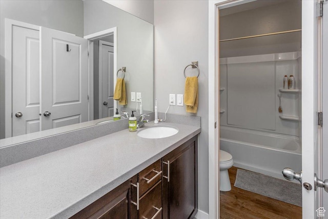 5402 W Mammoth Peak Pl, Herriman, UT 84096 - bathroom with vanity, toilet, wood finished floors, and washtub / shower combination