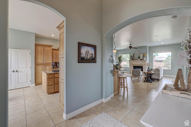 1163 W Sunrise Cir, Washington, UT 84780 - hallway with arched walkways, light tile patterned floors, recessed lighting, and baseboards