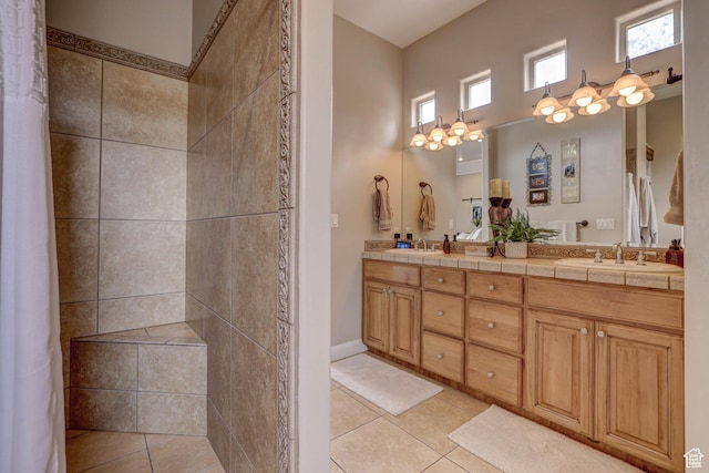 1163 W Sunrise Cir, Washington, UT 84780 - full bath featuring tile patterned flooring, a sink, a tile shower, and double vanity