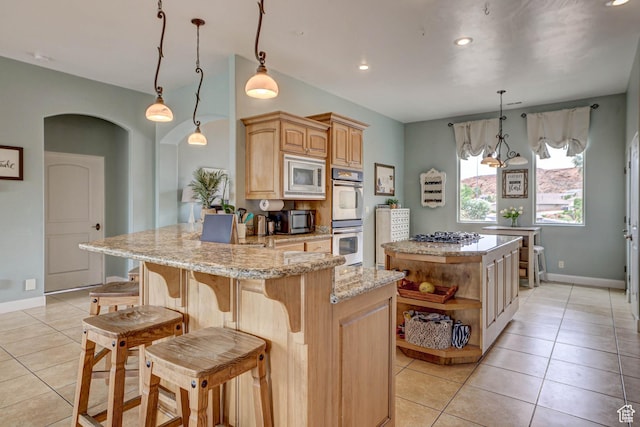 1163 W Sunrise Cir, Washington, UT 84780 - kitchen with a center island, open shelves, hanging light fixtures, light brown cabinetry, and appliances with stainless steel finishes