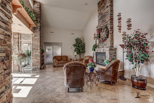 1163 W Sunrise Cir, Washington, UT 84780 - living room featuring high vaulted ceiling, a stone fireplace, and baseboards