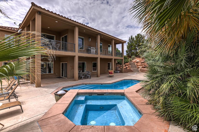 1163 W Sunrise Cir, Washington, UT 84780 - view of pool featuring an in ground hot tub and a patio area