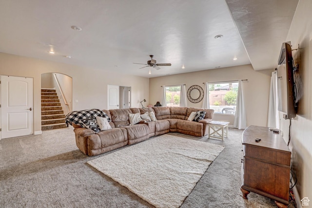 1163 W Sunrise Cir, Washington, UT 84780 - living room featuring light carpet, stairway, arched walkways, and recessed lighting