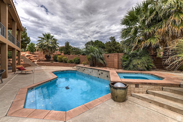 1163 W Sunrise Cir, Washington, UT 84780 - view of swimming pool featuring an in ground hot tub, a patio, a fenced backyard, and a fenced in pool