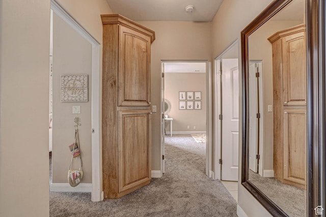 1163 W Sunrise Cir, Washington, UT 84780 - hall with light colored carpet and baseboards