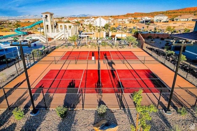 1466 N Arena Roja Dr, Washington, UT 84780 - view of sport court featuring a residential view, fence, and a mountain view
