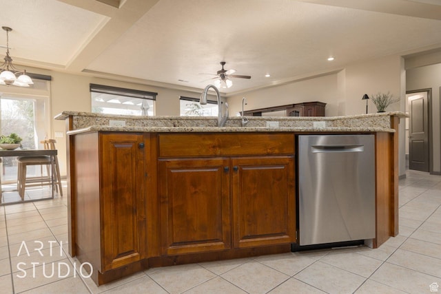 1109 N Ventana Dr, Washington, UT 84780 - kitchen with hanging light fixtures, stainless steel dishwasher, and brown cabinetry