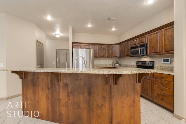 1109 N Ventana Dr, Washington, UT 84780 - kitchen with stainless steel appliances, a large island, and a kitchen breakfast bar