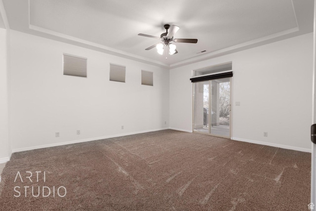 1109 N Ventana Dr, Washington, UT 84780 - unfurnished room featuring a raised ceiling, dark carpet, baseboards, and ceiling fan