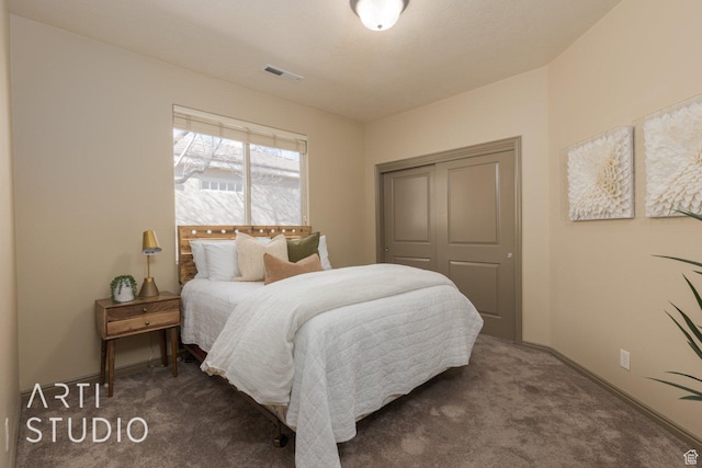 1109 N Ventana Dr, Washington, UT 84780 - bedroom featuring baseboards, visible vents, dark carpet, and a closet
