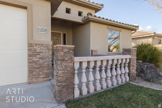 1109 N Ventana Dr, Washington, UT 84780 - exterior space featuring stone siding, covered porch, and stucco siding