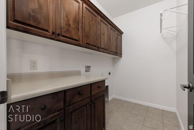 1109 N Ventana Dr, Washington, UT 84780 - laundry area featuring cabinet space, baseboards, light tile patterned floors, and washer hookup