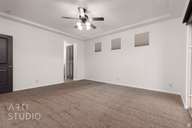 1109 N Ventana Dr, Washington, UT 84780 - unfurnished room featuring carpet floors, baseboards, a tray ceiling, and a ceiling fan