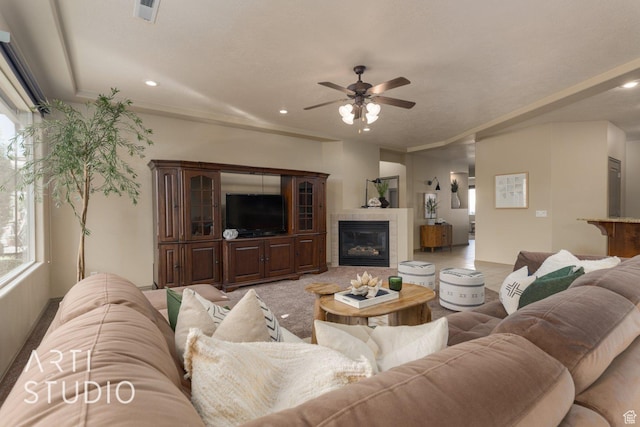 1109 N Ventana Dr, Washington, UT 84780 - living area featuring visible vents, a tile fireplace, ceiling fan, ornamental molding, and recessed lighting
